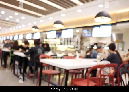 Blur image Canteen Dining Hall Room, A lot of people are eating food in University canteen blur background, Blurred background cafe or cafeteria Stock Photo