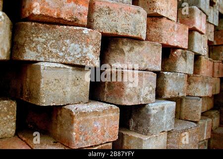 The bricks are stacked up at the construction site. Stock Photo