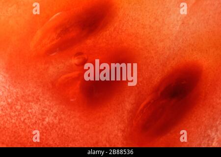 Discovering details of tomato's pulp. Creative, magical macro image of fruit interior. Abstract, fresh, fruity background with enhanced texture, fiber Stock Photo