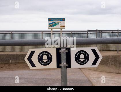 England Coast Path National Trail sign along the promenade between Maplethorpe and Sutton on Sea, Lincolnshire, UK Stock Photo