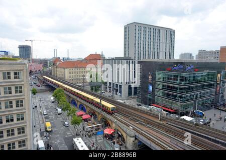 Berlin, Germany 05-17-2019 aerial of a city train approach the station Alexanderplatz, view to buildings and business buildings and restaurants Stock Photo