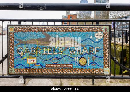Mosaic name sign of Gabriel's Wharf, a mixed use enclave with restaurants and small designer shops on the South Bank of the River Thames, London SE1 Stock Photo