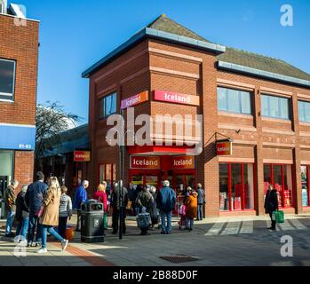 Northwich, Cheshire/Uk March 20th 2020: Shoppers queuing outside Iceland supermarket during the corona virus crisis, Northwich, Cheshire Uk. Stock Photo