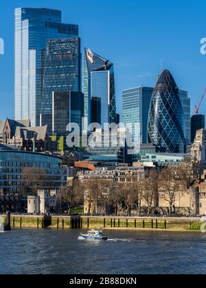 London River Thames Police boat passes part of the City of London Financial District. Metropolitan Police Marine Policing Unit (MPU) River Police Boat. Stock Photo