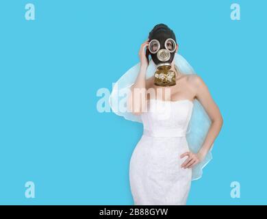 cyberpunk Bride in veil dress and protective gas mask and veil posing.  wedding Style spring-summer 2020 Stock Photo - Alamy