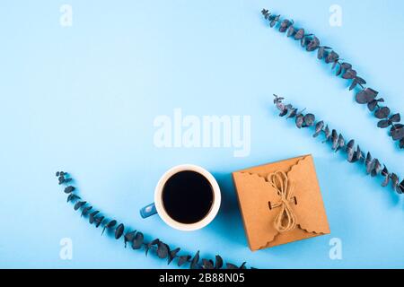 Mother's Day Composition: Eustoma, eucalyptus, tulips and a gift boxes on a blue background. Top view.Flat lay. Stock Photo