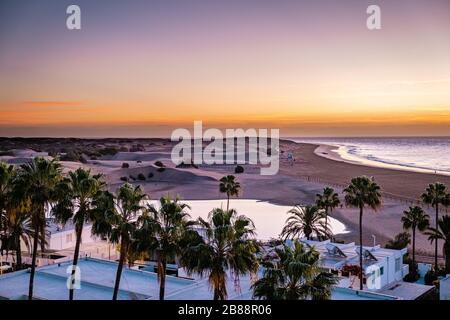 Sand dunes beach of Maspalomas Gran Canaria during sunrise Stock Photo