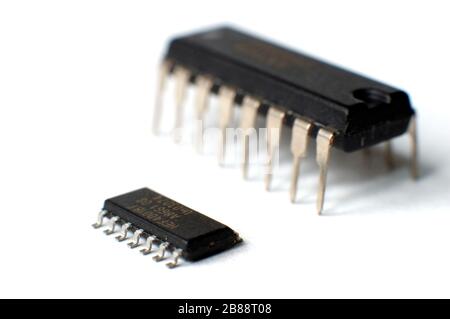 Close up electronic chip in DIP and SOIC case. Two different case electronic chips. The concept of electrical appliances and equipment Stock Photo