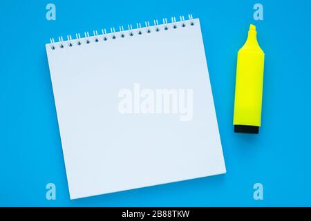 Open blank notebook and marker on blue background. Copy space. Education, planning concept. Text space Stock Photo