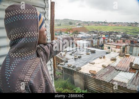 Soweto, Johannesburg, South Africa - December 5, 2019 - Shacks have no water, residents use communal toilets and connect to electricity illegally Stock Photo