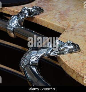 the ornate hand rail along the bar in the Palm Court Lounge of the art deco Burgh Island Hotel. Burgh Island, Devon, England, UK Stock Photo