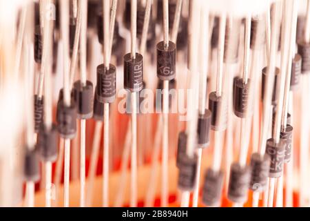 Metal rods with black iron small diodes in the production of large household appliances and equipment for the printing house. Concept of Computer Hard Stock Photo