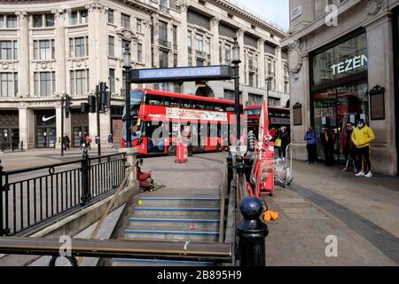 London, UK. 20th March 2020.  Only a few pedestrians around Oxford Circus, normally the busiest area of London. Stock Photo