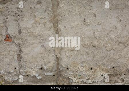 A very old deteriorated and dirty, swollen concrete wall background Stock Photo