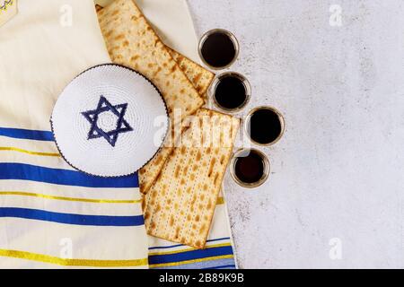 Matzoh jewish holiday red kosher four cup wine with a of matzah a Passover Haggadah Stock Photo