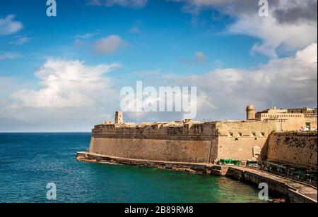 The Saint Elmo Bay and the city walls of Valletta, in Malta. Stock Photo