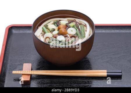 Japanese Sansai soba noodles in a ceramic bowl with chopsticks Stock Photo