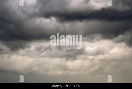 Clouds gather and turn dark, indicating stormy weather is on the way Stock Photo