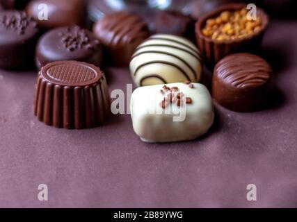Delicious fancy chocolates close up with room for copy Stock Photo