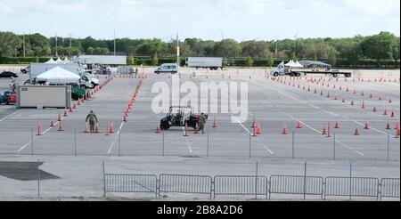 Miami, USA. 20th Mar, 2020. The Army Corps of Engineers set up a parking lot for Coronavirus testing and staging of the Florida National Guard at the Hard Rock Stadium on Friday, March 20, 2020 in Miami, Florida. This test site is scheduled to handle Miami area residents to help identify the Coronavirus Pandemic. Photo by Gary I Rothstein/UPI Credit: UPI/Alamy Live News Stock Photo