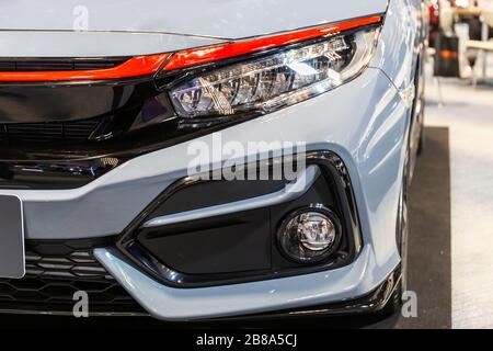 Close up of detail on one of the LED headlights modern and luxury gray car. Select focus. Stock Photo
