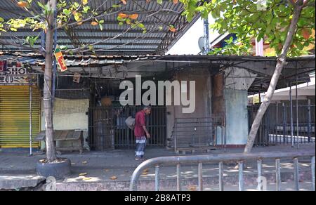 Colombo, Sri Lanka. 21st Mar, 2020. A man Walk an empty street is seen after the authorities announced a weekend curfew in a country as a preventive measure against the spread of the COVID-19 novel coronavirus, in Colombo March 21, 2020. Credit: Pradeep Dambarage/ZUMA Wire/Alamy Live News Stock Photo