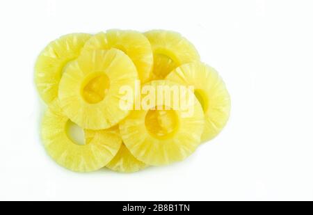 Pineapple rings. Pineapple slice isolated on white background. Canned pineapple. Flat design. Top view. Stock Photo