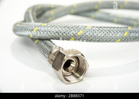 Old gas hose for cook stove on a white Stock Photo