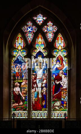 Stained glass window Washbrook church, Suffolk, England, UK by Ward and Hughes c 1870 Crucifixion and Sacrifice of Isaac Stock Photo