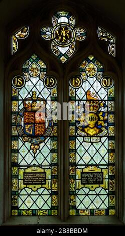 Stained glass window Washbrook church, Suffolk, England, UK memorial Queen Victoria 1819-1901 Royal Coat of Arms Stock Photo