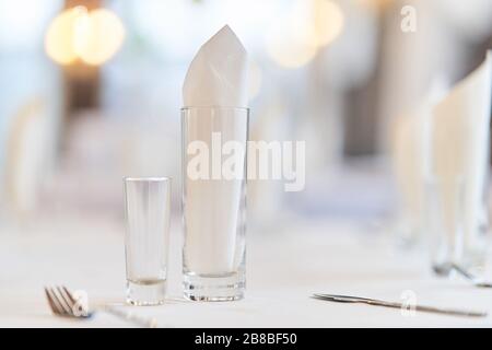 Glass with a glass on the festive table.  Stock Photo