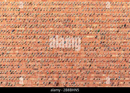 Adelaide, Australia - January 26, 2020:  Thousands of toy cars glued to the brick wall on Rosina street public car park in Adelaide city Stock Photo