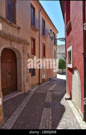 A narrow street between the houses of the medieval village of Nusco, in southern Italy Stock Photo