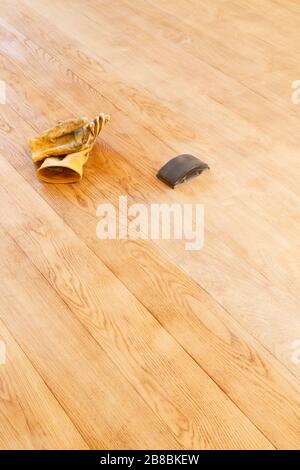 Floor restoration using a sanding block. Home renovations project, UK Stock Photo