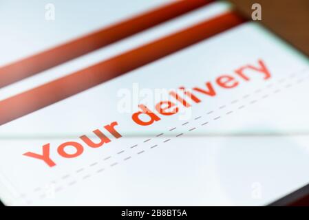 your delivery text on smart phone screen. Stock Photo