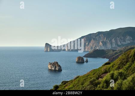 Pan di Zucchero faraglione, a big rock near Masua, Sardinia, Italy Stock Photo