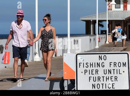 Daytona Beach, United States. 20th Mar, 2020. People walk on the pier during a spring break at Daytona Beach after Florida Governor Ron DeSantis refused to order the state's beaches closed as the number of COVID-19 cases increases across the state. Local officials have closed other Florida beaches, including those in Miami, Ft. Lauderdale, and Tampa. Credit: SOPA Images Limited/Alamy Live News Stock Photo