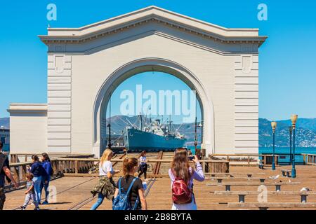 Ferry Arch and SS Jeremiah O'Brien Liberty Ship at Pier 43 San Francisco USA Stock Photo