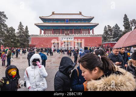 Tourists in front of Shenwumen - Gate of Divine Prowess also called Gate of Divine Might - northern gate of Forbidden City in Beijing, China Stock Photo