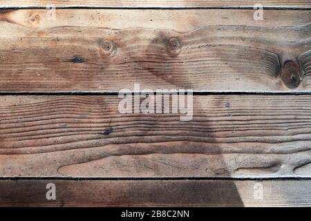 Rustic old brown wooden plank for background and design concepts. Natural light. Stock Photo