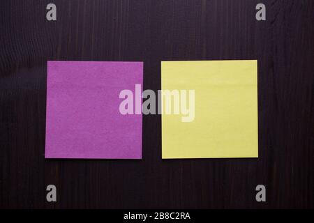 collection of various empty colorful sticky notes paper on wooden background Stock Photo