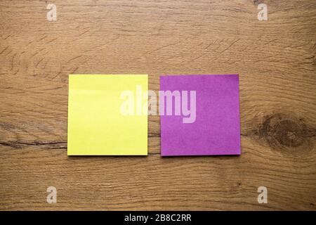 collection of various empty colorful sticky notes paper on wooden background Stock Photo