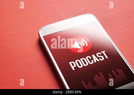 Podcast app on smartphone. Listening to sound and audio entertainment with mobile phone concept. Stock Photo