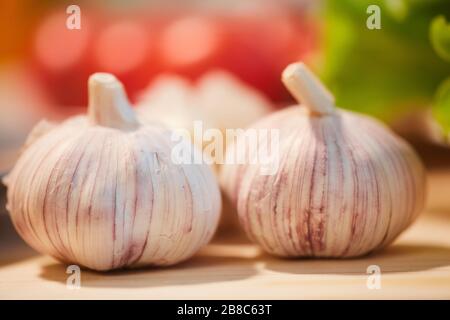 Close-up of two garlics on the table preparing for cooking in the kitchen Stock Photo