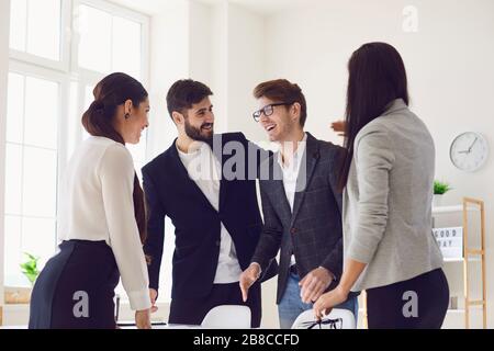 Happy business people smiling at meeting workplace in office. Business team A diverse group of employees are working analyze in a meeting meeting at a Stock Photo