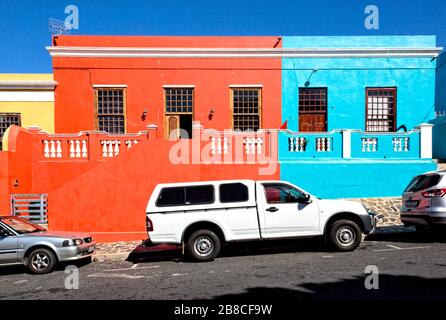 Canary yellow, bitter orange and baby blue. The brilliant colours of Wale Street in Bo-Kaap. Stock Photo