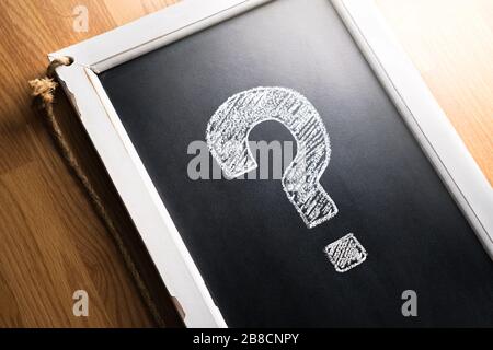 Question mark drawn on chalkboard.  Ģ����ý, help or info for business. Survey, poll or quiz concept. Punctuation, decision, feedback or education. Stock Photo