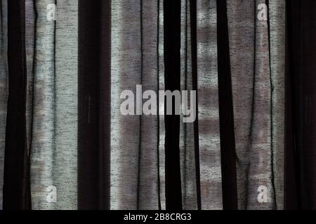 Closeup of translucent curtain closed in front of a window Stock Photo