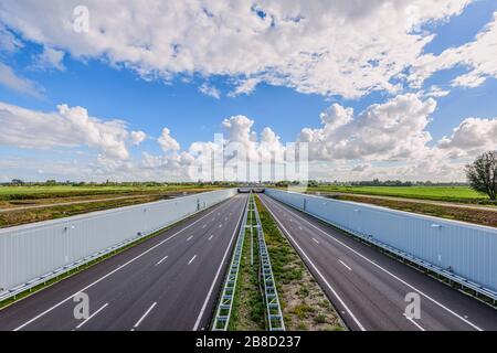 No traffic on this empty deserted modern deepened highway A4, The Hague - Rotterdam, Netherlands. Stock Photo