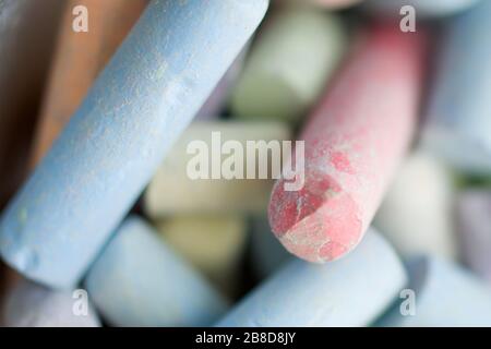 Colored chalk for drawing background. Closeup view. Stock Photo